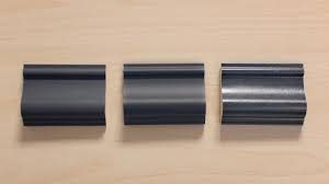 Three pieces of trim with different paint sheens