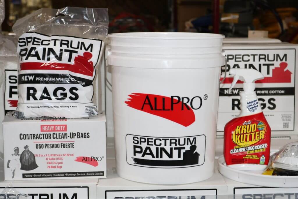 Spectrum Paint project essentials, including 1 lb. package of white rags, 1 box of heavy duty Contractor Clean-Up Bags, 5 gallon Spectrum Paint bucket, Krud Kutter 32 oz. bottle