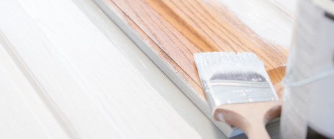 Primer being applied to cabinets
