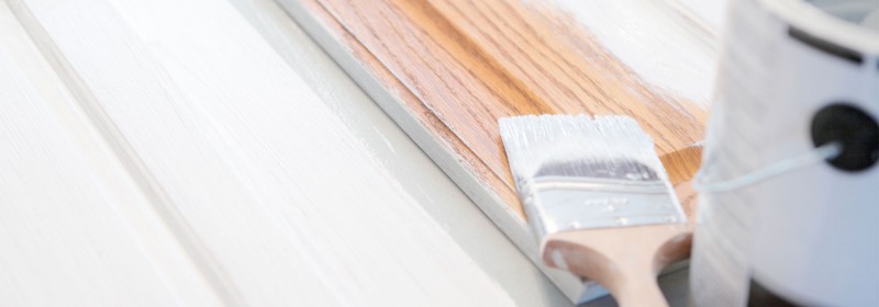 Primer being applied to cabinets